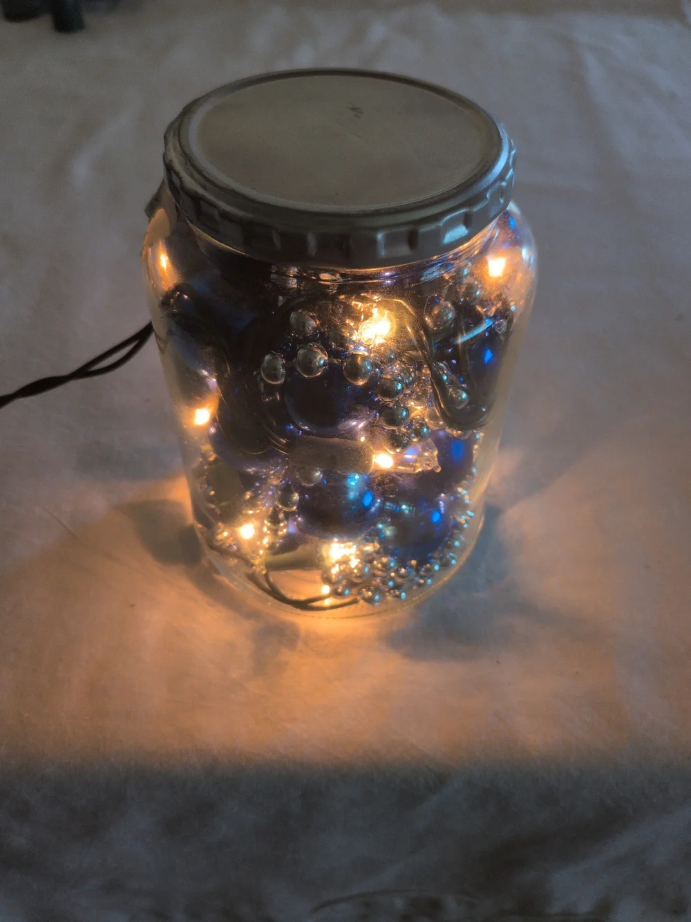 Holiday Glass Jar of Blue Ornaments and Lights - Home Holiday